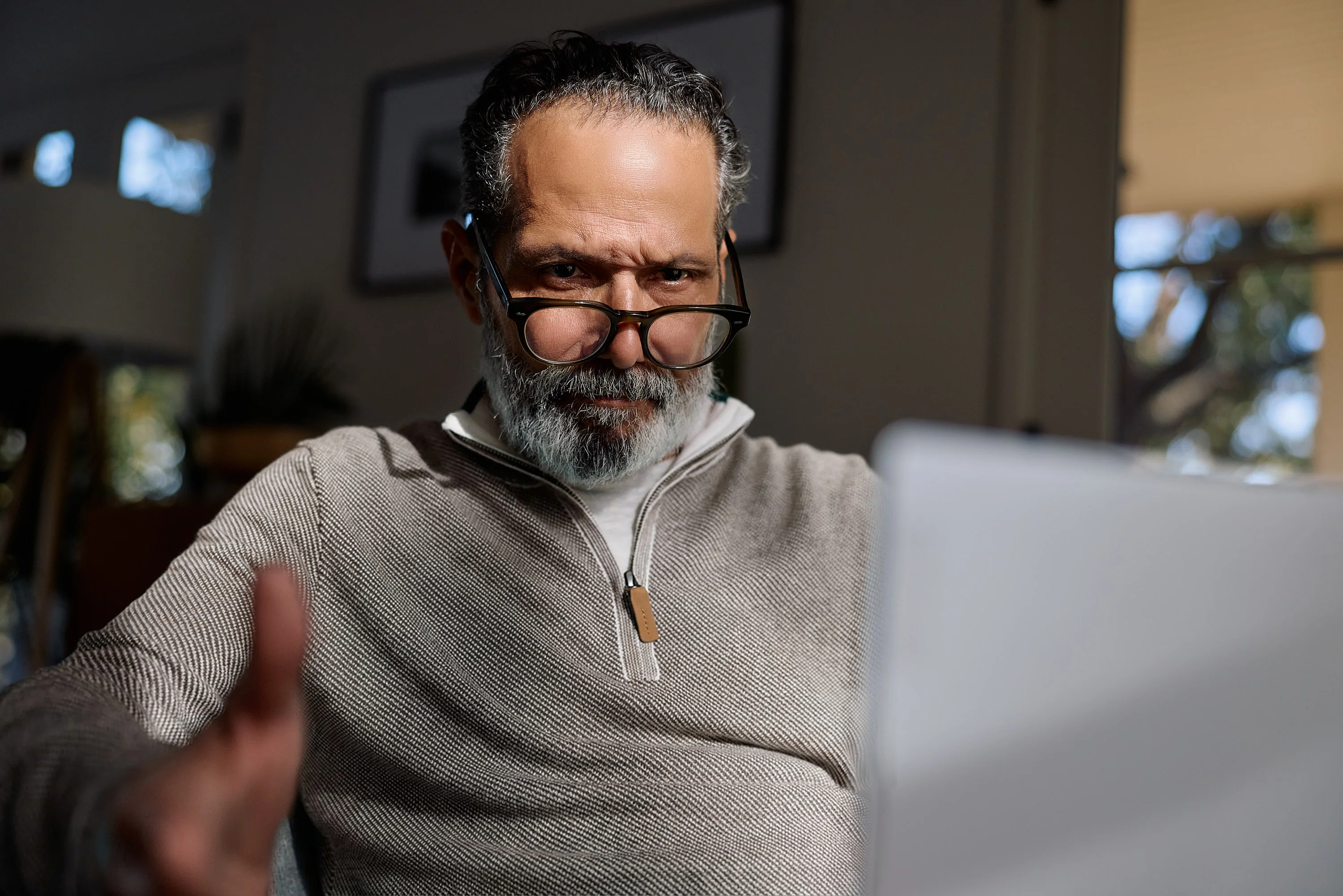 Anthony looking over his glasses at a laptop in the eero campaign
