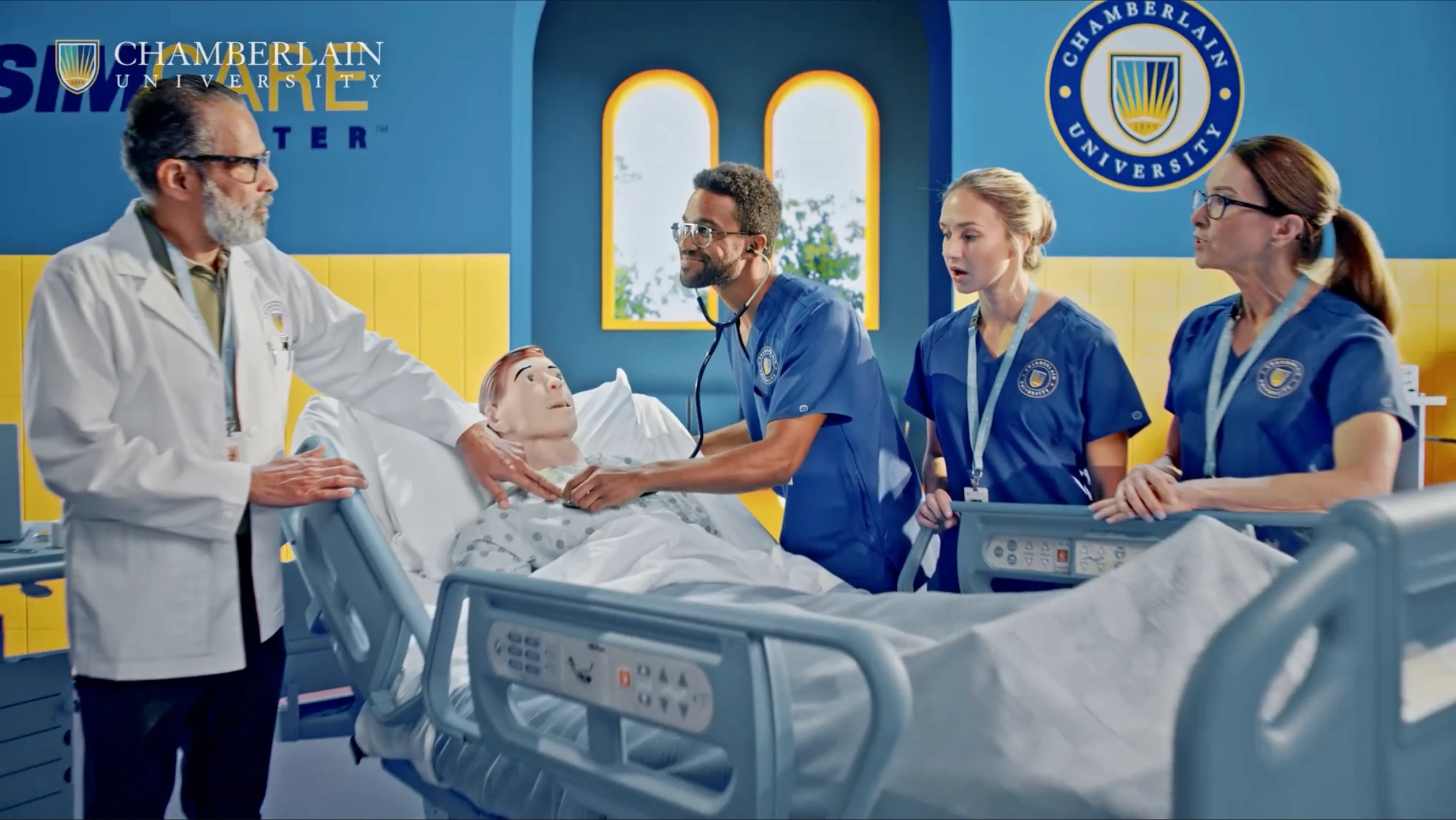 Anthony on the left with nursing students in the Chamberlain University commercial